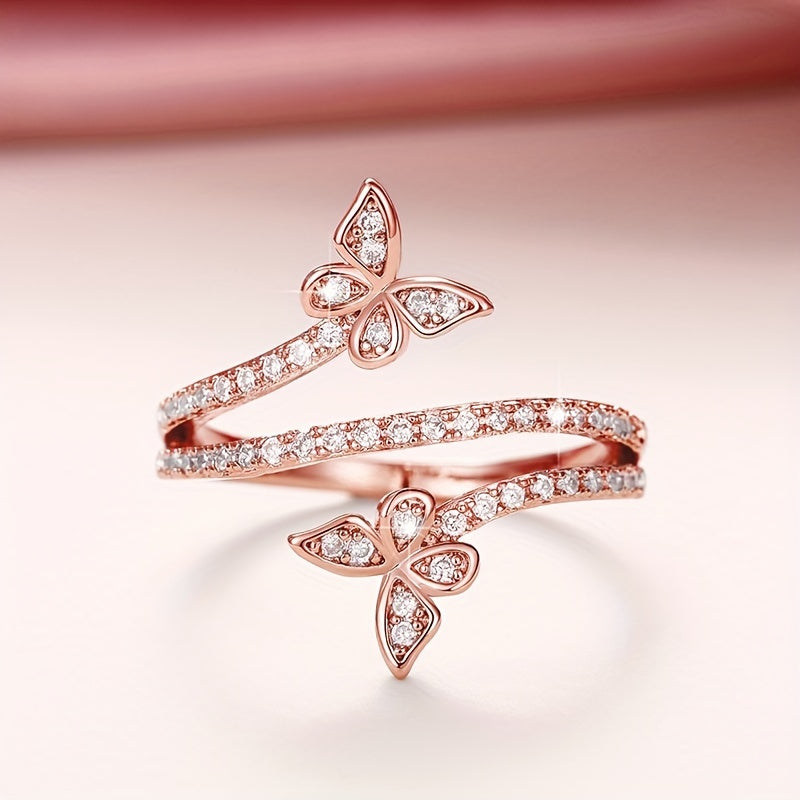 Anillo con mariposas y circonitas engastadas en oro blanco
