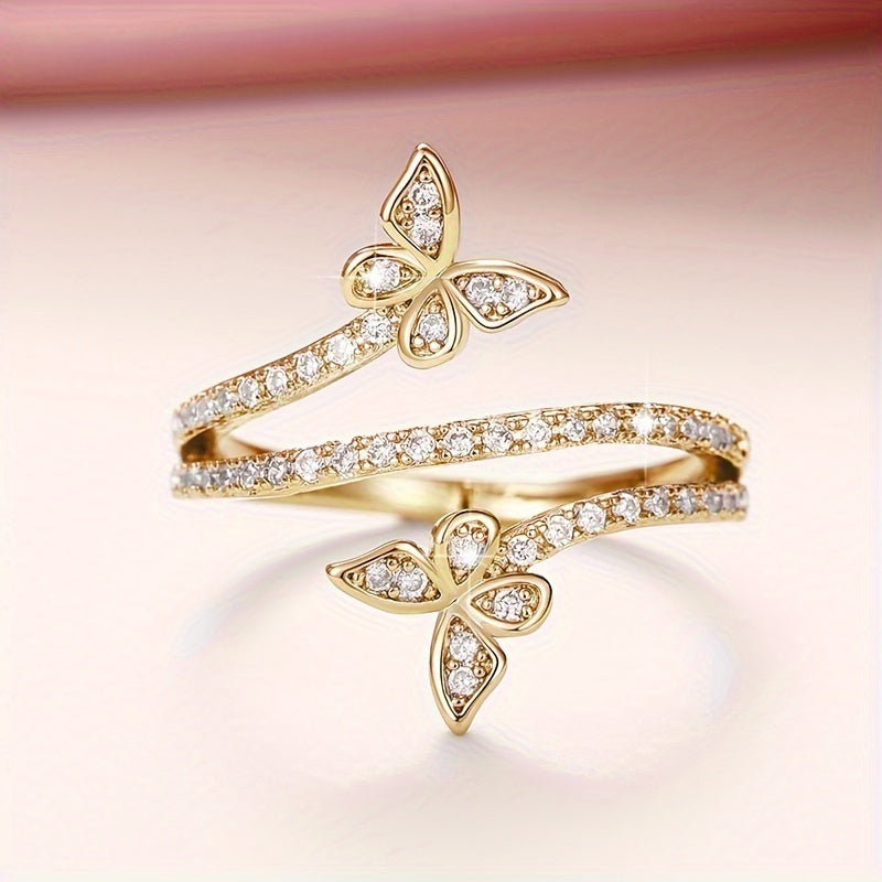 Anillo con mariposas y circonitas engastadas en oro blanco